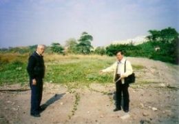 Local resident Mr. Sun and Historian Mr. Hsieh point to location of the former burial plot where those who died on the Enoura Maru were first buried in 1945.
